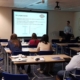 Classroom of people learning about gears