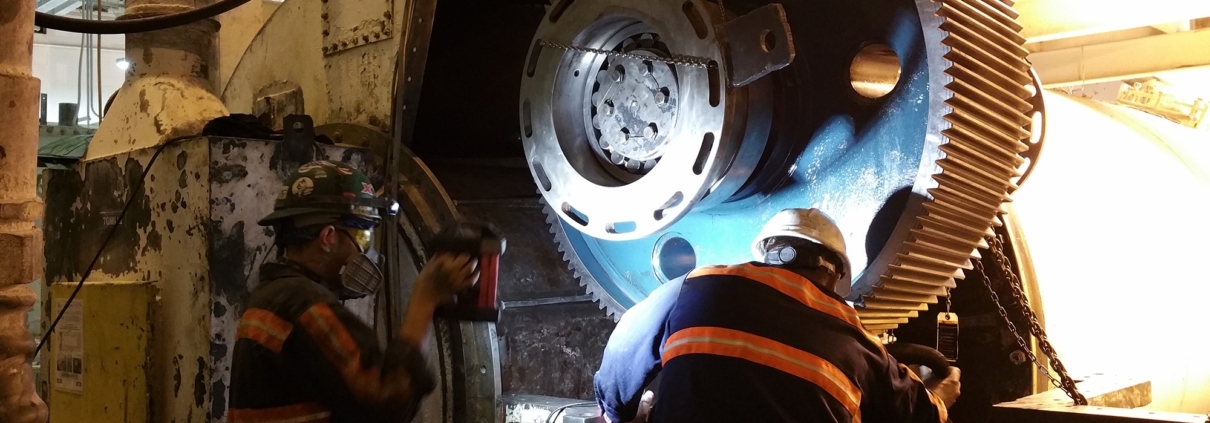 Men Installing Large Gear