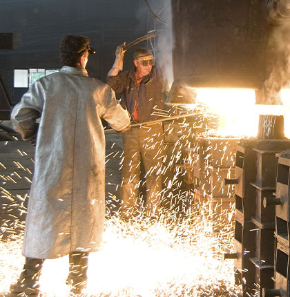 Men working in metal mill