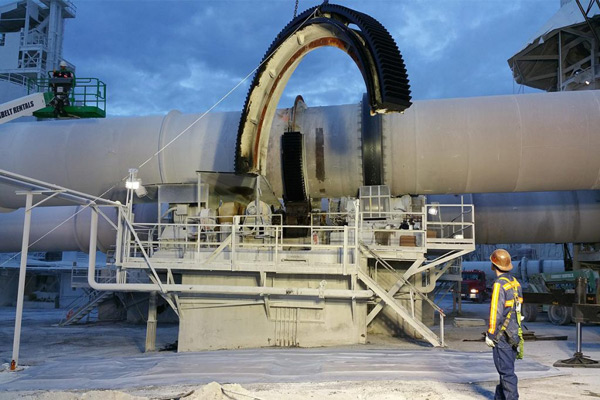Large gear being lifted by crane